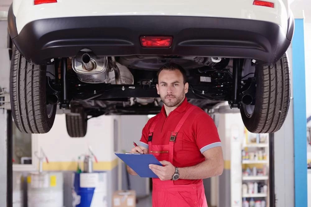 Man Inspecting car engine