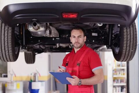 Man Inspecting car engine